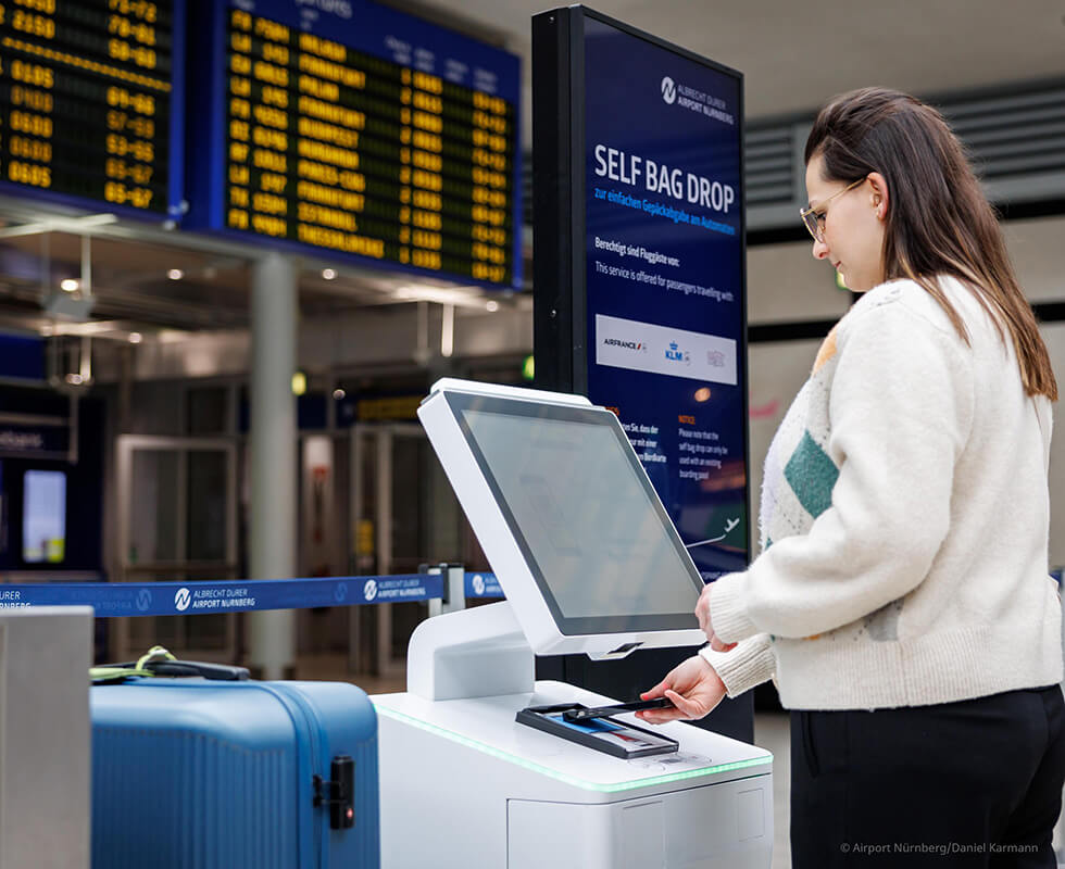 Self-service bag drop system